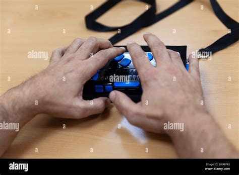blind  visually impaired person typing  smart brailler stock photo