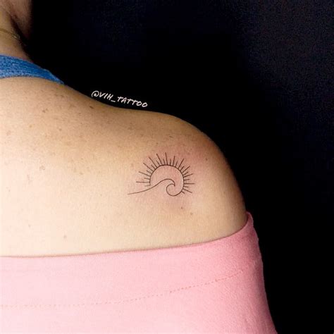 Simple Wave and Sun Tattoo on Shoulder by Vinicius Rosa