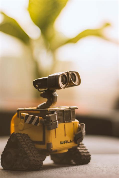 Wall-e Toy on Beige Pad · Free Stock Photo