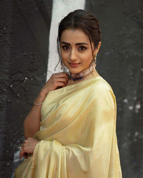 Actress Trisha Krishnan looks very gorgeous in Gold Colour Saree at