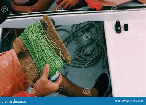 Close Shot of a Male Holding a Fishing String with a Blurred Background ...