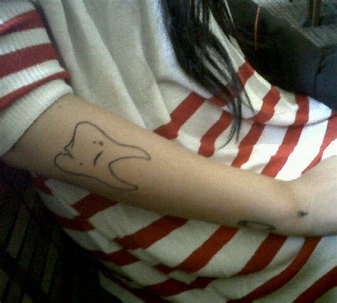 Hanna Beth Merjos Tooth Forearm Tattoo | Steal Her Style