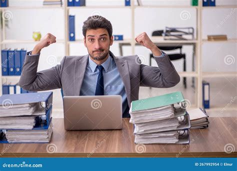 Young Male Employee and Too Much Work in the Office Stock Photo - Image ...