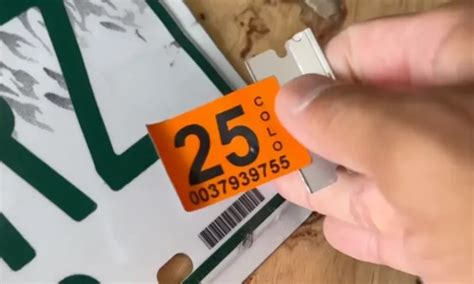 how to put registration sticker on car windshield