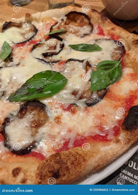 Italian Pizza with Pomodoro, Mozzarella and Melanzane Stock Photo