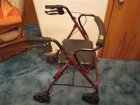Invacare rolling walker w/ seat - Integrity Auctioneers