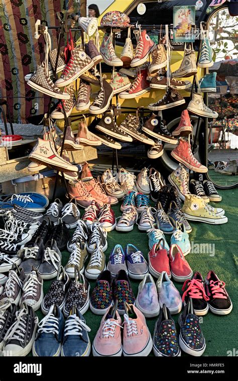 Sneakers footwear and casual shoes for sale at a Thai street market ...