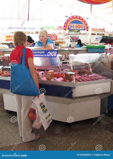 A Woman Buying Meat for Sale in the Komarovsky Marketplace, Minsk ...