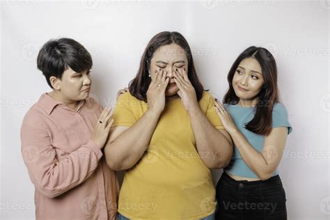 A portrait of three friends looking sad crying wiped her tears and hug ...