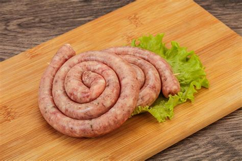 Raw sausage ring for grill 8475501 Stock Photo at Vecteezy