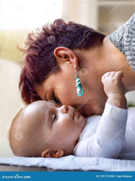 Mom kissing his son stock photo. Image of leisure, closeness - 120715108