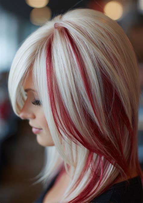 Hair - Platinum blonde with scarlet streaks – bold color blocking that