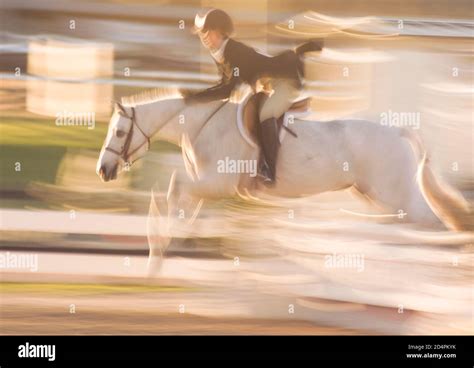 young girl  pony compete  show jumping stock photo alamy