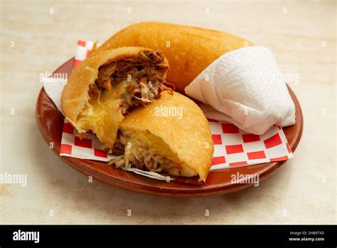 latin american food venezuelan empanada peluda shredded meat