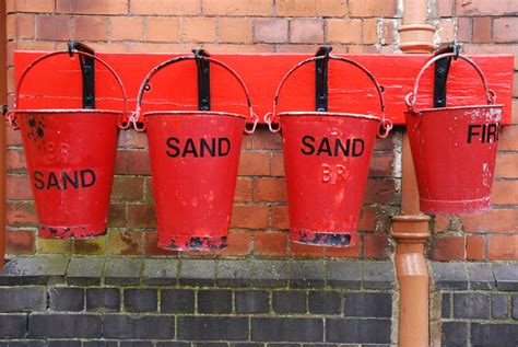bucket  sand  put   fire