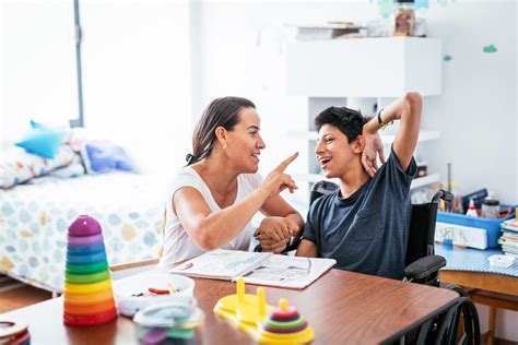 Latina mother and son with Celebral Palsy singing together.