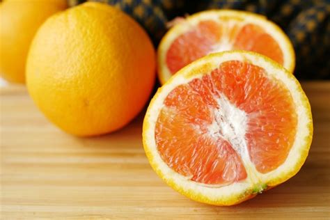 Premium Photo | Close up of slice of orange fruit on color background