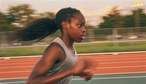 Premium Photo | A dynamic photo of a young Black female athlete running ...