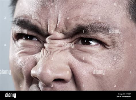 Extreme Close up on angry mans face Stock Photo - Alamy