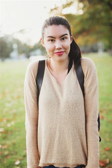 "Young Student Woman Looking At Camera Outside Shrugging." by Stocksy