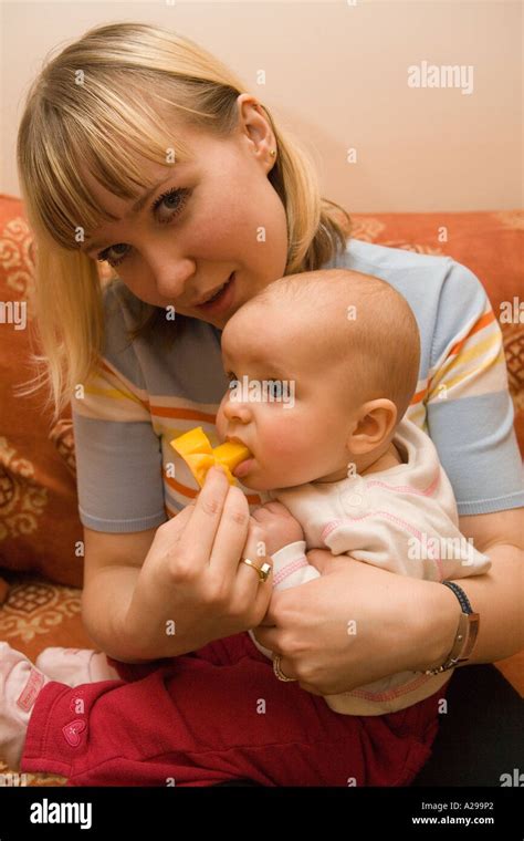 Her first taste of mango! Stock Photo - Alamy