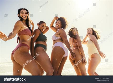 group young women dancing  bikinis stock photo