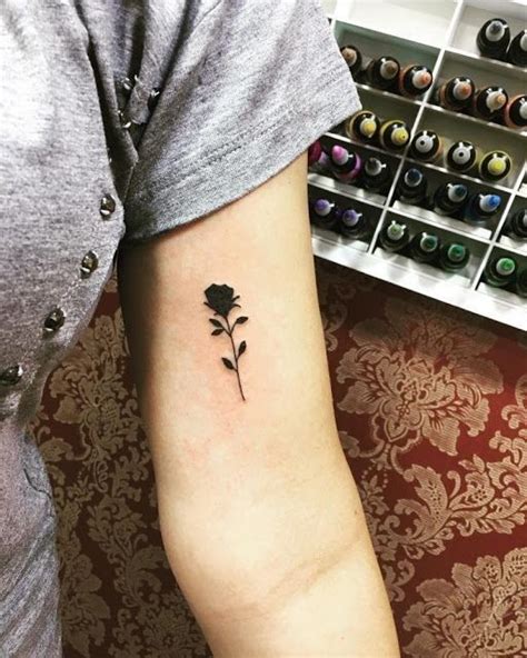 Stunning small black rose tattoo designs
