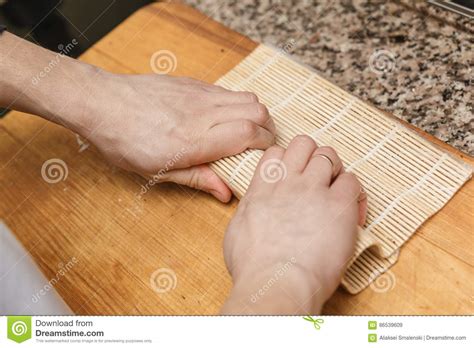 Preparing, rolling sushi. stock image. Image of gourmet - 86539609