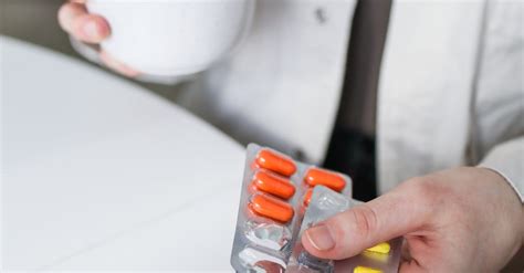 person holding blister packs  stock photo