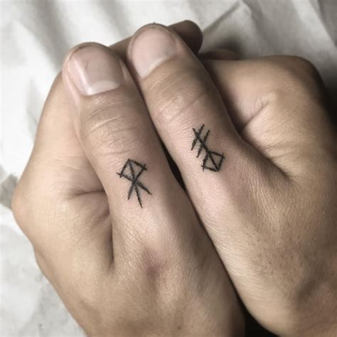 Rune tattoos on both thumbs | Hand and finger tattoos, Finger tattoos ...