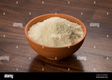 Food: Raw Unrefined Cane Sugar in Earthen Bowl on Wooden Background ...