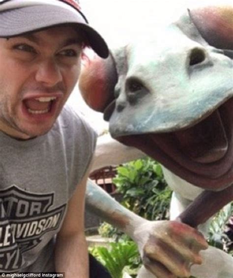 Ashton Irwin shows off his manly chest as he holidays with girlfriend ...