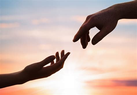 Hands Reaching Out To Each Other Stock Photo - Download Image Now ...