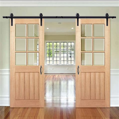 modern interior double sliding barn wood doors  glass inserts hanse