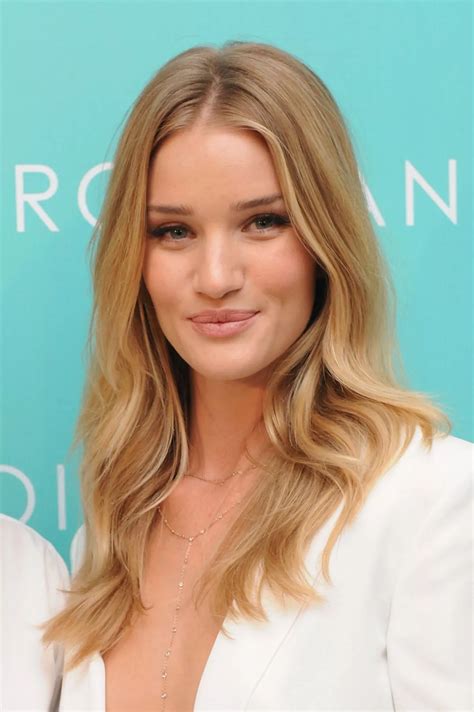 Rosie Huntington-Whiteley dares to bare her cleavage AGAIN in a simple