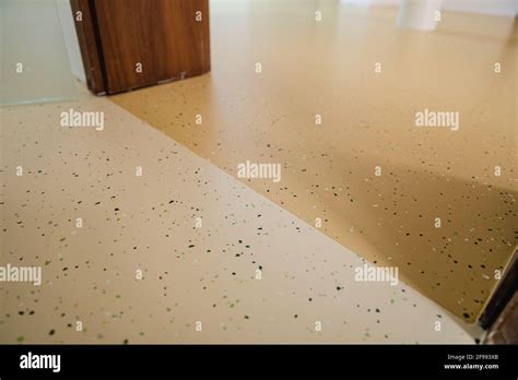 overhead shot   beige speckled floor   empty room stock photo