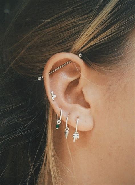 An industrial piercing is a piercing through two body holes.. Forward ...