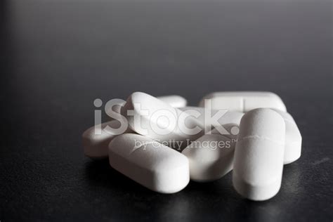 White Tablets On Dark Grey Stock Photo | Royalty-Free | FreeImages
