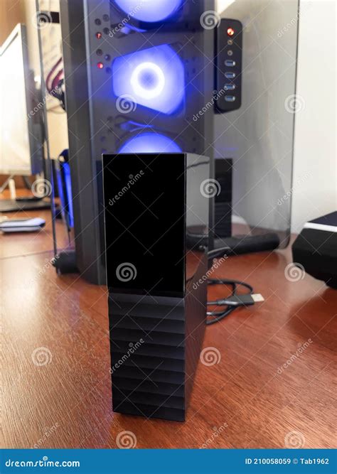 Close Up of an External USB Hard Drive with Computer in Background