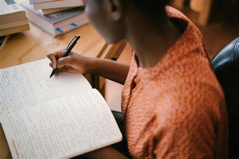 photo  woman writing  notebook  stock photo