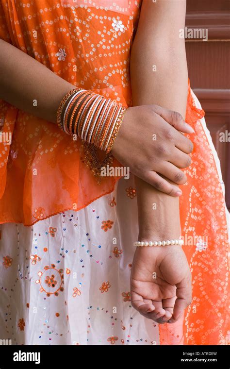 mid section view   teenage girl wearing bangles stock photo alamy