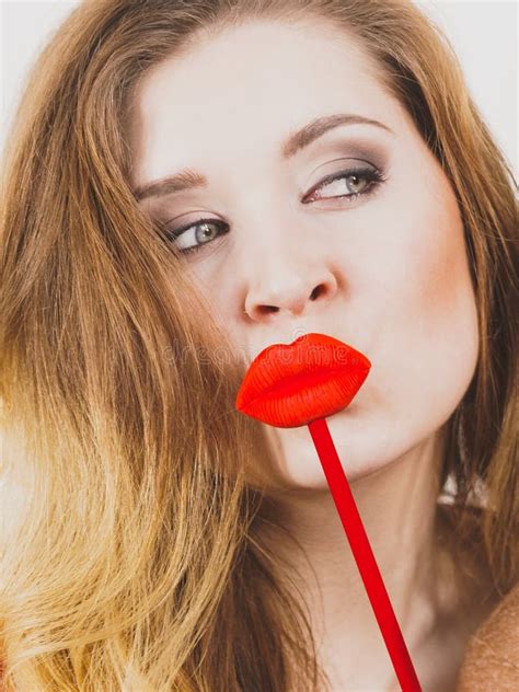 Woman Holding Big Red Fake Lips Stock Photo - Image of mask, lipstick ...