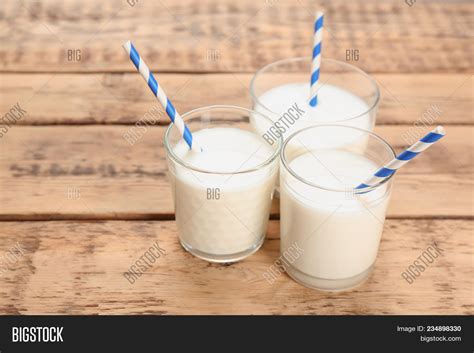 Glasses Milk On Wooden Image & Photo (Free Trial) | Bigstock