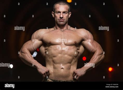 bodybuilder performing front lat spread poses  tunnel stock photo alamy