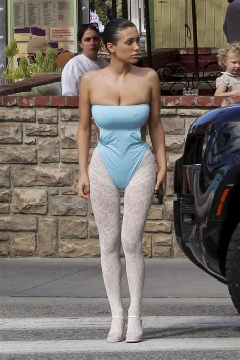 Bianca Censori Wears Strapless Blue Bodysuit on Movie Date with Kanye