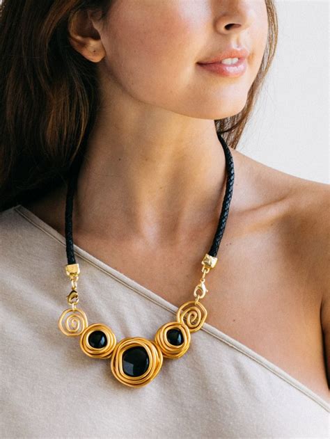 black necklace   glass stones  spiral details