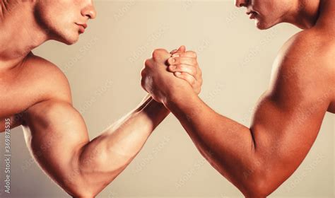 stockfoto med beskrivningen muscular hand clasped arm wrestling