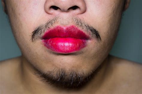 Premium Photo | Close-up of man wearing lipstick