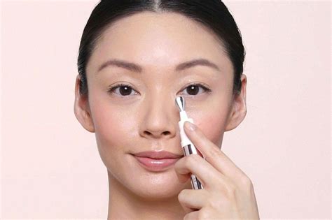 applying eye cream health beauty