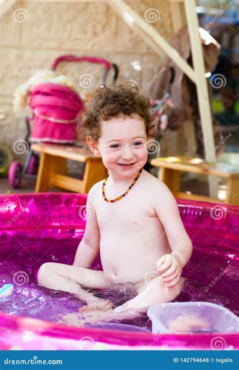 Adorable Toddler Playing in a Pool Stock Photo - Image of bubbles ...